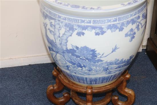 Two Chinese blue and white fish bowls on stands